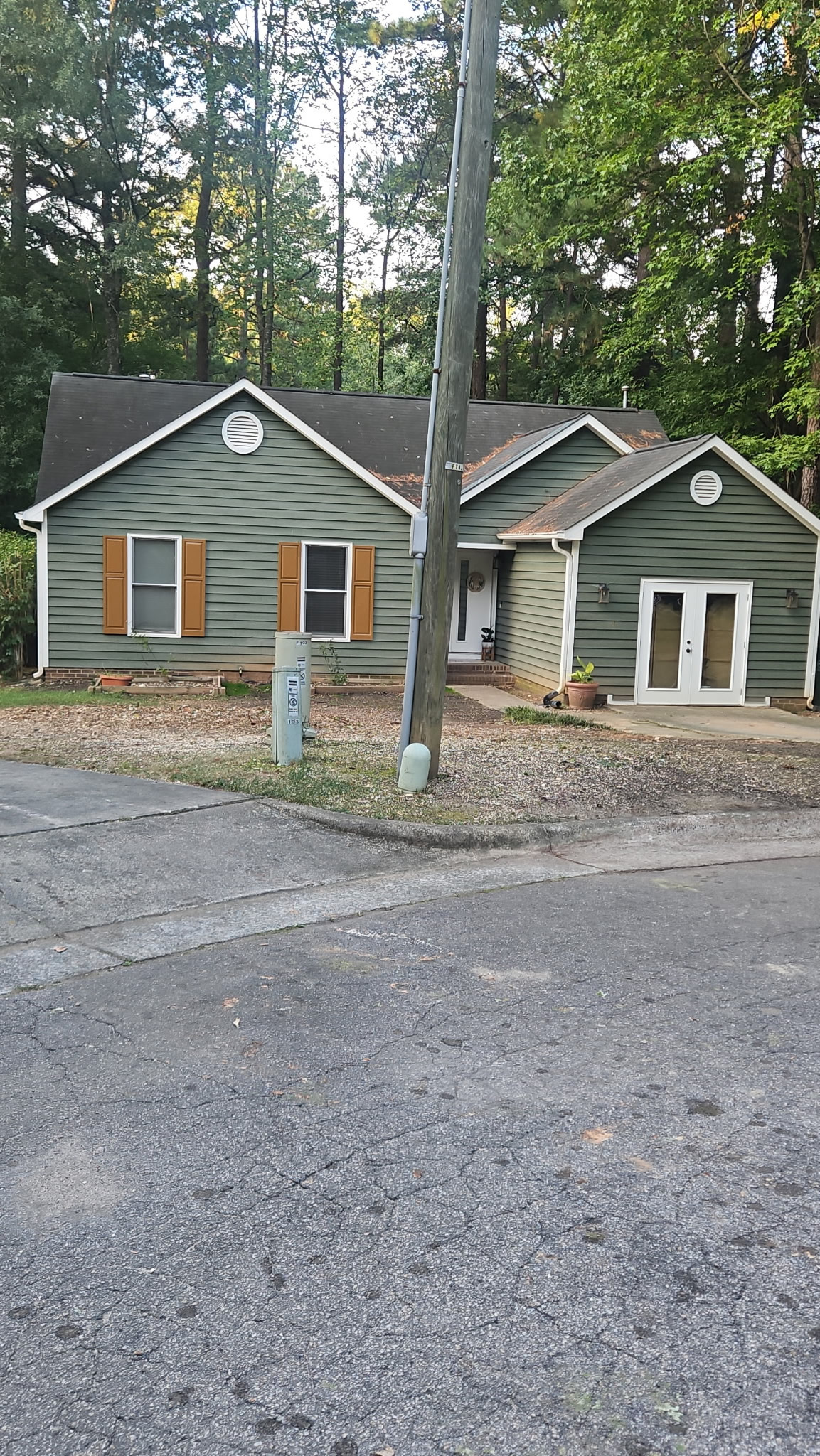 After photo showing completed tree removal at a residential property in Edgehill Farm, Cary NC.